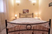 Posteľ alebo postele v izbe v ubytovaní Fontane Bianche Villa Jole