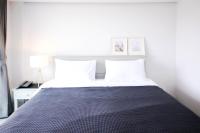 Postel nebo postele na pokoji v ubytování Tonkla Boutique Hotel