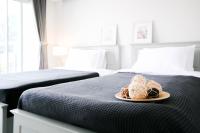 Postel nebo postele na pokoji v ubytování Tonkla Boutique Hotel