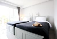 Postel nebo postele na pokoji v ubytování Tonkla Boutique Hotel