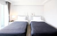 Postel nebo postele na pokoji v ubytování Tonkla Boutique Hotel