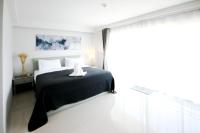 Postel nebo postele na pokoji v ubytování Tonkla Boutique Hotel
