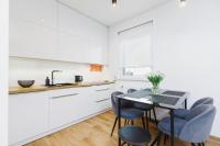 Kuchyňa alebo kuchynka v ubytovaní Apartments Supernova near Tauron Arena by Noclegi Renters