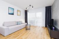Televízia a/alebo spoločenská miestnosť v ubytovaní Apartments Supernova near Tauron Arena by Noclegi Renters
