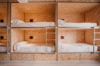 Postel nebo postele na pokoji v ubytování SubUp Hostel