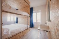 Postel nebo postele na pokoji v ubytování SubUp Hostel