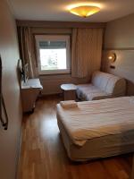 Postel nebo postele na pokoji v ubytování Hotell Stinsen