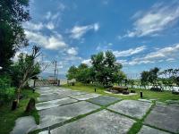 a park with a stone pathway and trees and a sky at CarNo B&amp;B in Yuanshan