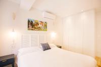 Posteľ alebo postele v izbe v ubytovaní Apartamentos San Marcial 28