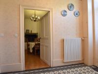 a hallway with an open door and a dining room at Gorgeous Holiday Home in Martigny le Comte with private Pool in Martigny-le-Comte