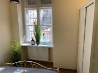 Postel nebo postele na pokoji v ubytování Pedal Apartman Szeged City