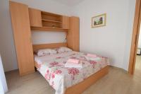 Łóżko lub łóżka w pokoju w obiekcie Apartments Buturajac