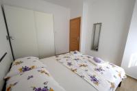 Łóżko lub łóżka w pokoju w obiekcie Apartments Buturajac