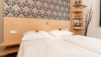 Postel nebo postele na pokoji v ubytování campuszwei - Hotel & Boardinghouse
