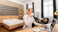 Postel nebo postele na pokoji v ubytování campuszwei - Hotel & Boardinghouse