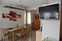 A television and/or entertainment centre at Appartement Sabrina
