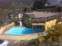 an overhead view of a house with a swimming pool at T2 RESIDENCE 3 ETOILES Piscine chauffée Sauna Hammam in Cauterets