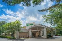 a hotel building with a sign that reads h pharmacy at Holiday Inn South Kingstown-Newport Area by IHG in South Kingstown