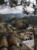 a view of a city with mountains in the background at Casa Cueva “La Estrella” in Granada