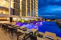 a hotel with a swimming pool at night at Crowne Plaza Vientiane by IHG in Vientiane