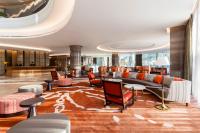 a lobby of a hotel with a couch and chairs at Crowne Plaza Vientiane by IHG in Vientiane