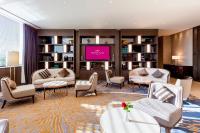 a living room with furniture and a flat screen tv at Crowne Plaza Vientiane by IHG in Vientiane