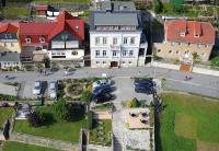 an aerial view of a city with cars parked in a parking lot at Elbresidenz am Nationalpark in Stadt Wehlen