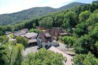 an aerial view of a small town in the mountains at Domaine du Hirtz, Restaurant &amp; Spa in Wattwiller