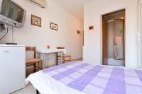 Łóżko lub łóżka w pokoju w obiekcie Rooms & Apartments Hegic