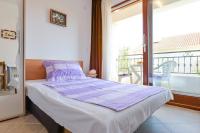 Łóżko lub łóżka w pokoju w obiekcie Rooms & Apartments Hegic