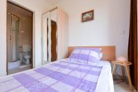 Łóżko lub łóżka w pokoju w obiekcie Rooms & Apartments Hegic