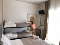 Posteľ alebo postele v izbe v ubytovaní Hotel Kim