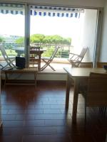 a room with chairs and a table and a large window at AS13247 - P2 Cabine climatisé avec belle vue sur la Mer in Le Grau-du-Roi