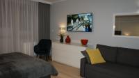 Televízia a/alebo spoločenská miestnosť v ubytovaní Apartament Agata