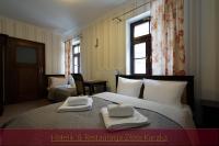 Postel nebo postele na pokoji v ubytování Hotelik & Restauracja Złota Kaczka
