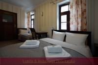 Postel nebo postele na pokoji v ubytování Hotelik & Restauracja Złota Kaczka