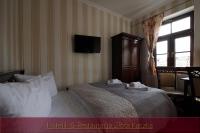 Postel nebo postele na pokoji v ubytování Hotelik & Restauracja Złota Kaczka