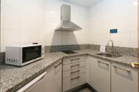 A kitchen or kitchenette at Aparthotel Campus
