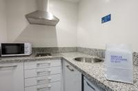 A kitchen or kitchenette at Aparthotel Campus