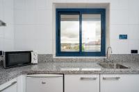 A kitchen or kitchenette at Aparthotel Campus