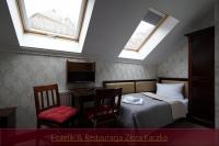 Postel nebo postele na pokoji v ubytování Hotelik & Restauracja Złota Kaczka