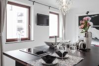 Televízia a/alebo spoločenská miestnosť v ubytovaní Apartment 24 Premium Old Town Wroclaw
