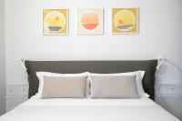 A bed or beds in a room at IseoLakeRental - La Villina - Zù