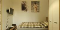 Posteľ alebo postele v izbe v ubytovaní Apartament Kosciuszki