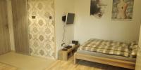 Posteľ alebo postele v izbe v ubytovaní Apartament Kosciuszki