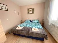 Posteľ alebo postele v izbe v ubytovaní Apartman SAN