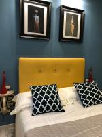 A bed or beds in a room at Frida Kahlo appartament