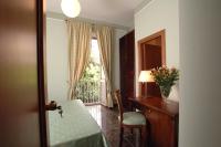 A bed or beds in a room at Le Stanze Del Vicerè Boutique Hotel