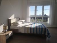 Postel nebo postele na pokoji v ubytování Sun Apartments