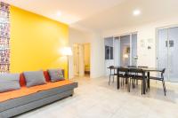a living room with a couch and a table at Casa Io - Bica in Mindelo